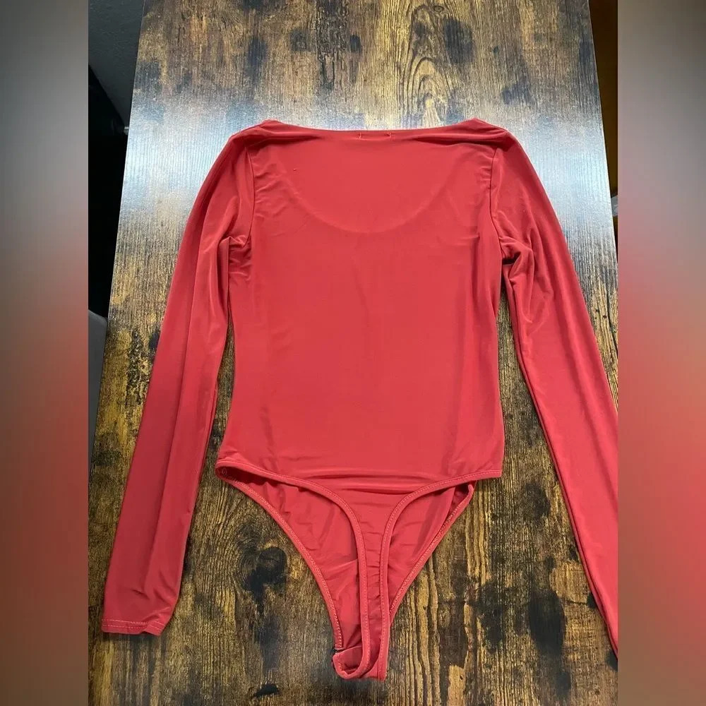 Boohoo Silky orange long sleeve bodysuit
Size 4 - Picture 6 of 8